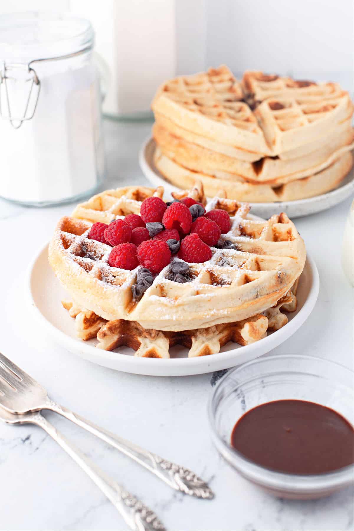 Stack of waffles with chocolate chips.