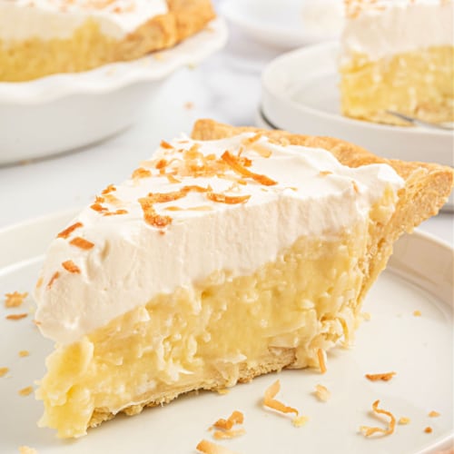 This Coconut Cream Pie has a sweet and creamy custard filling, a flaky crust and a thick layer of whipped cream with toasted coconut flakes on top. It's a coconut lover's dream!