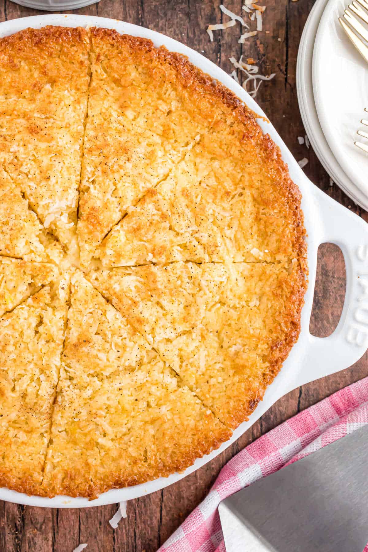 Coconut pie baked in a white pie plate.