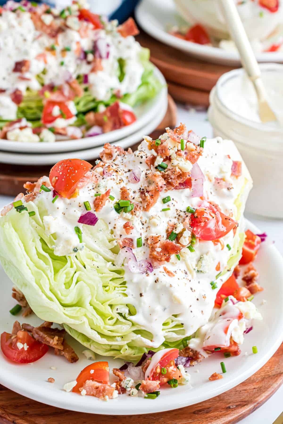 Wedge salad served on a white plate.