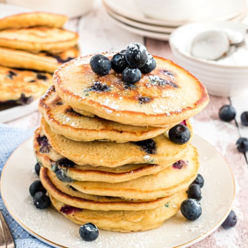 Start your day with a batch of Blueberry Pancakes for breakfast. This easy pancake recipe only takes a few minutes to make. It’s full of fresh blueberries with a hint of lemon zest flavor. 