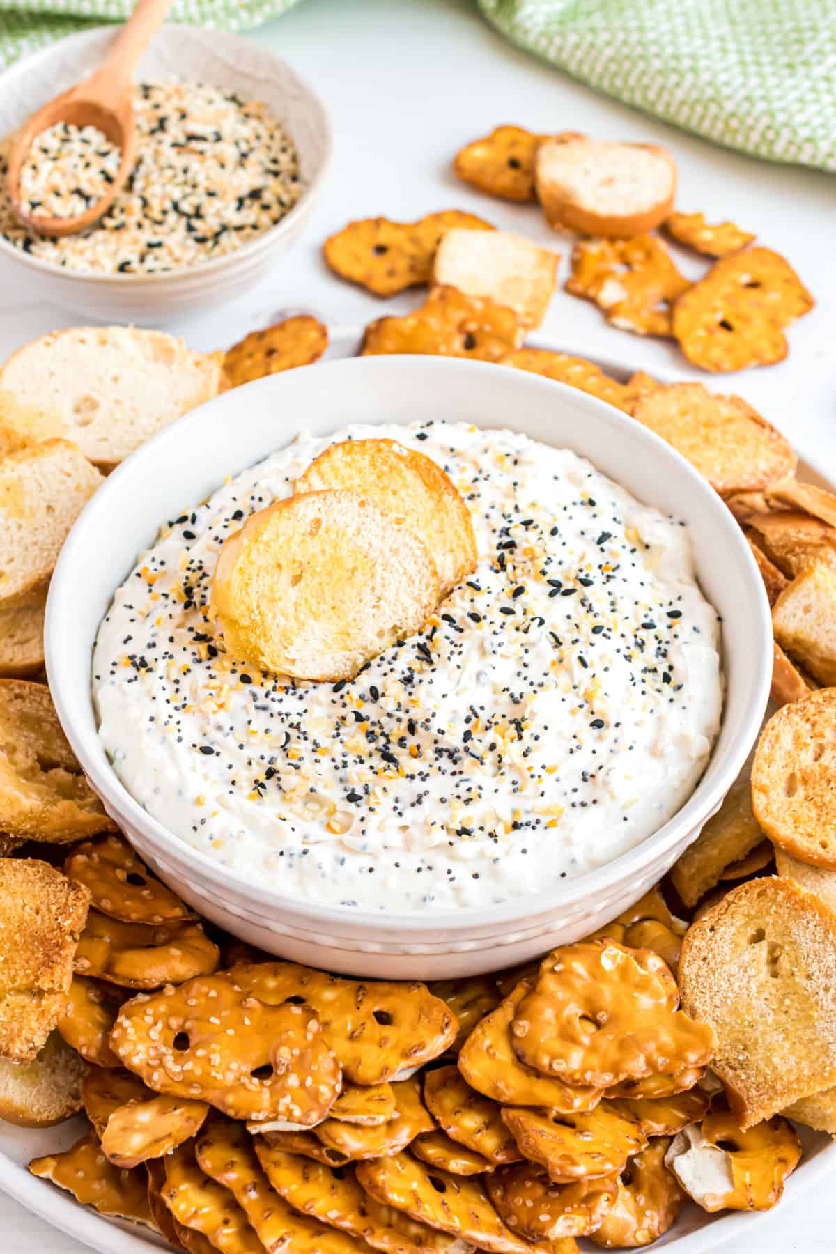 Everything bagel dip in a white serving bowl.