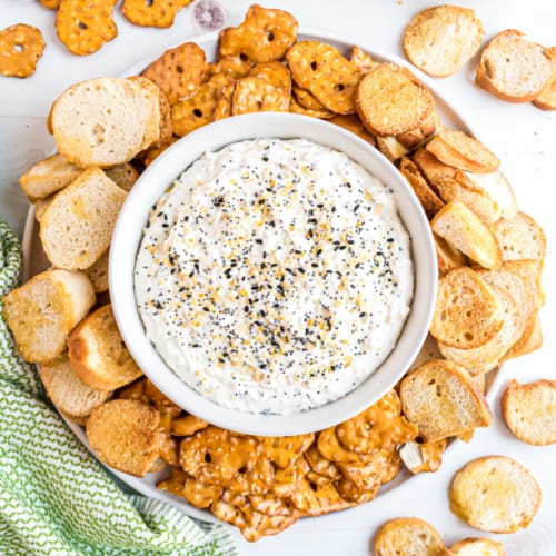 This Everything Bagel Dip recipe is done in 5-minutes with just four ingredients. If you love an everything bagel, then this dip recipe is going to knock your socks off.