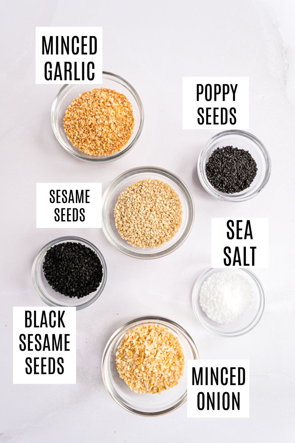 Ingredients needed to make homemade everything bagel seasoning.