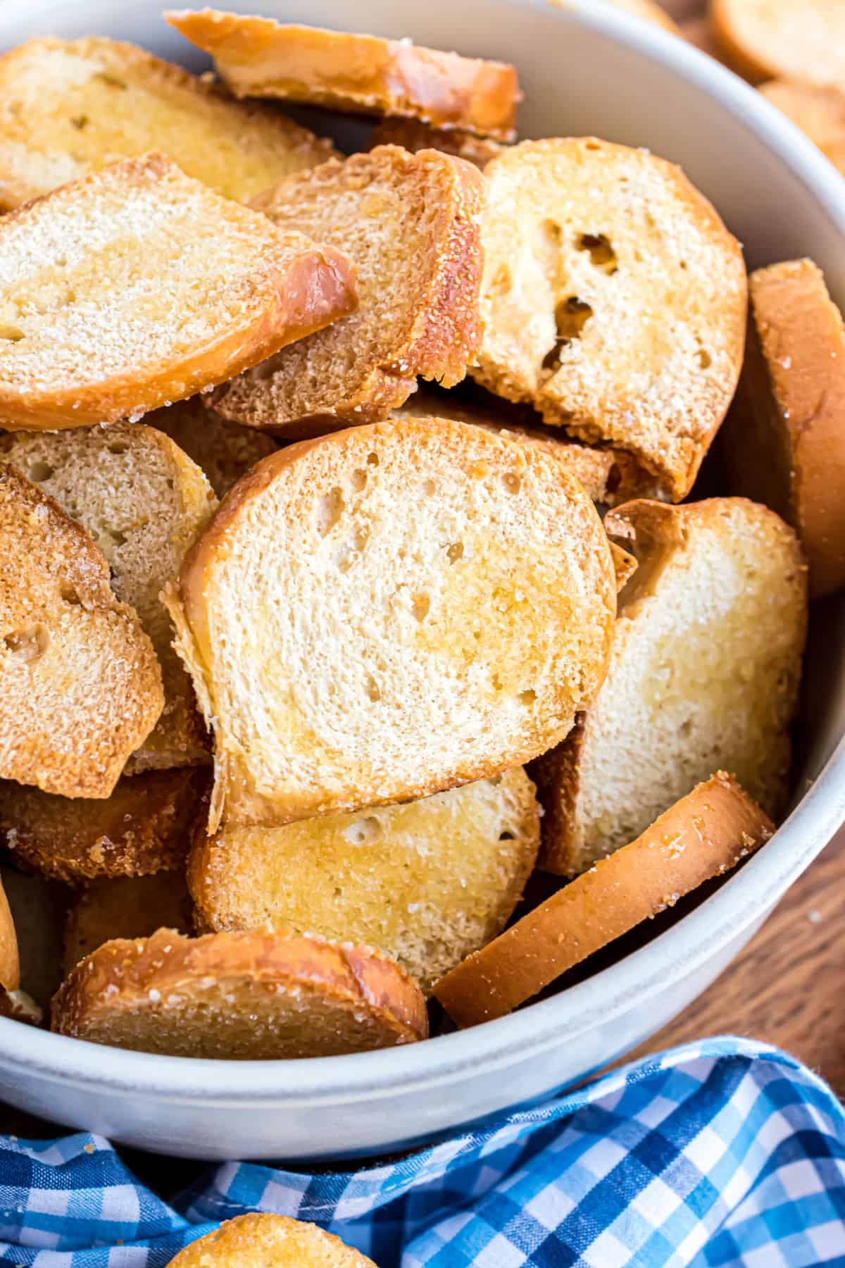 Homemade bagel chips in a white bowl.