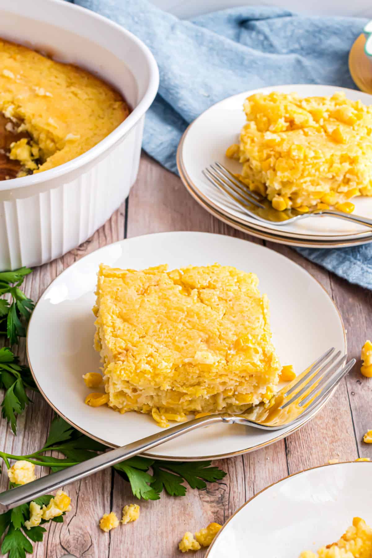 Cornbread casserole served on a white plate.