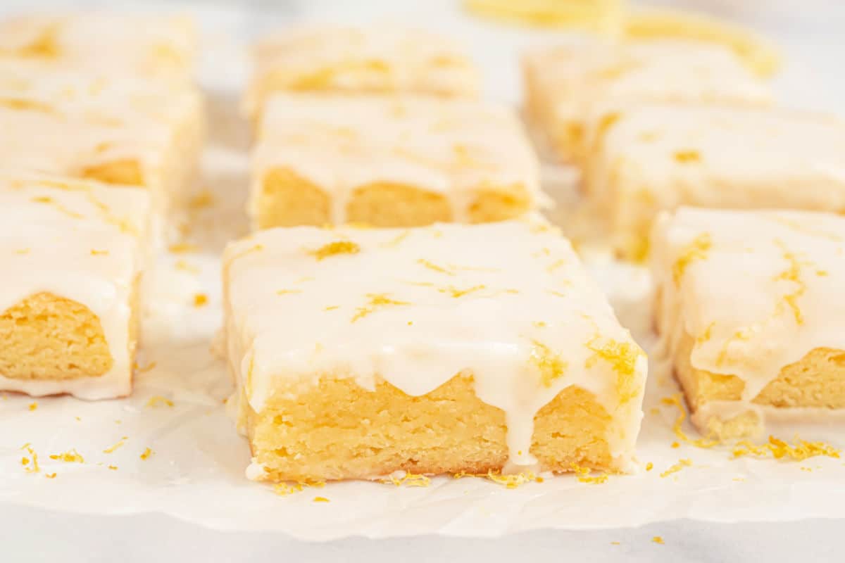 Lemon brownies on parchment paper.