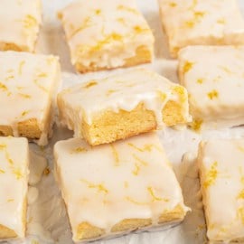 Soft, chewy Lemon Brownies are a refreshing twist on a classic dessert. With fresh lemon in the brownies and a zingy glaze, they’re irresistible! Perfect for summertime gatherings and picnics, you can have this easy recipe ready in under an hour.