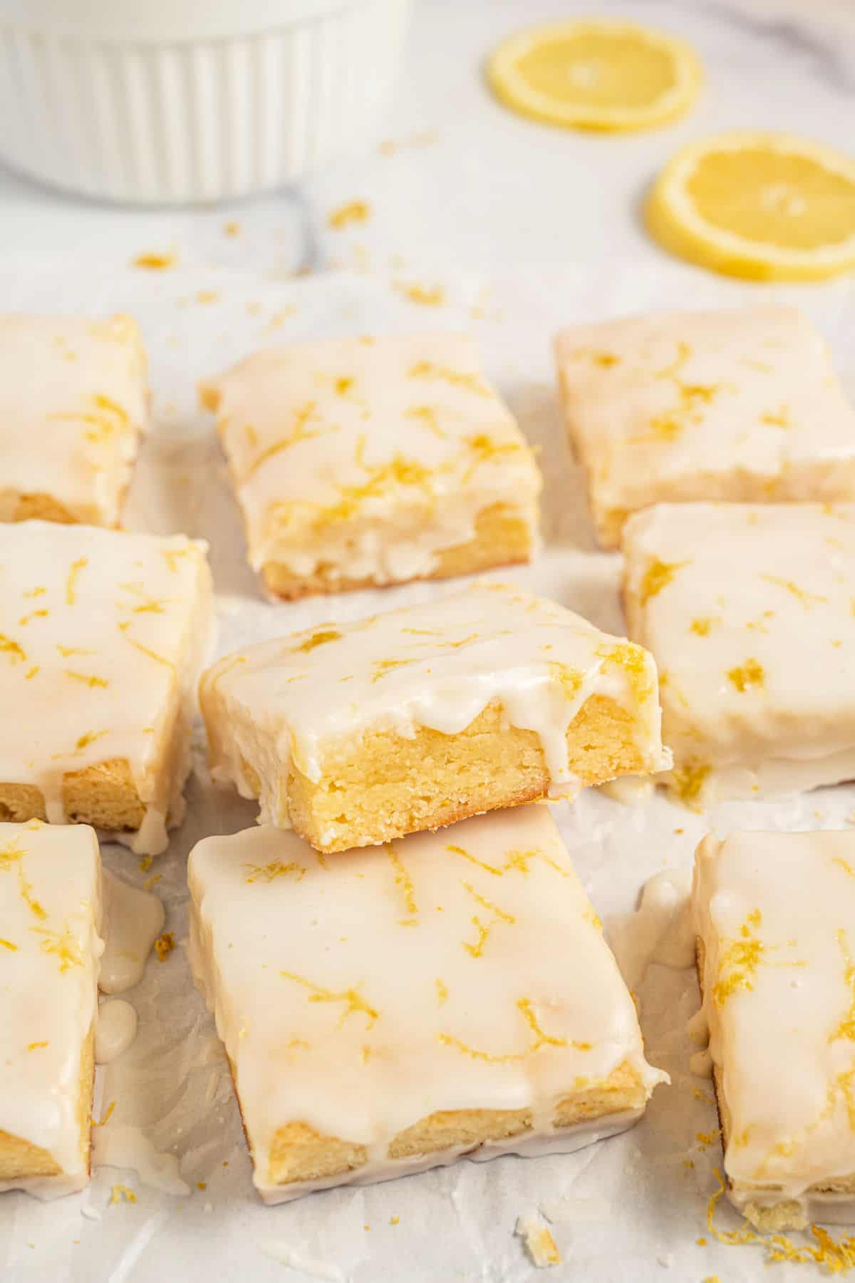 Lemon brownies topped with lemon icing.