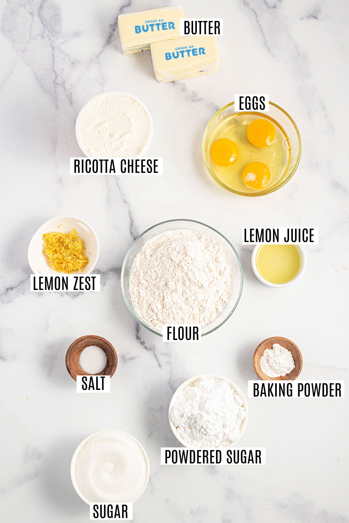 Ingredients needed to make lemon ricotta cake.