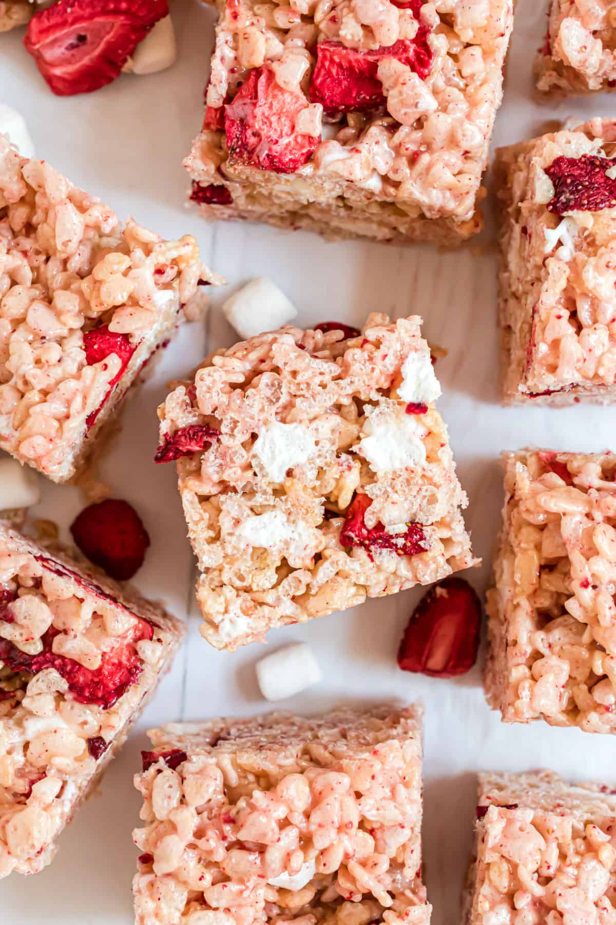 Strawberry rice krispie treats cut into large bars.