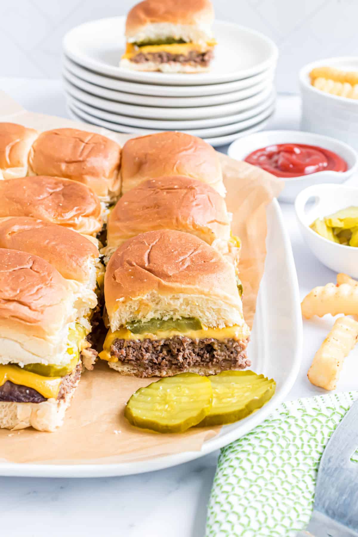 Serving plate with white castle burgers.