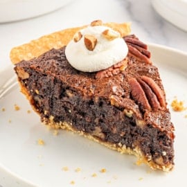 My decadent Chocolate Pecan Pie takes a holiday classic to new heights! Classic sweet and sticky pecan pie filling is blended with semi-sweet chocolate for a dreamy taste and texture.