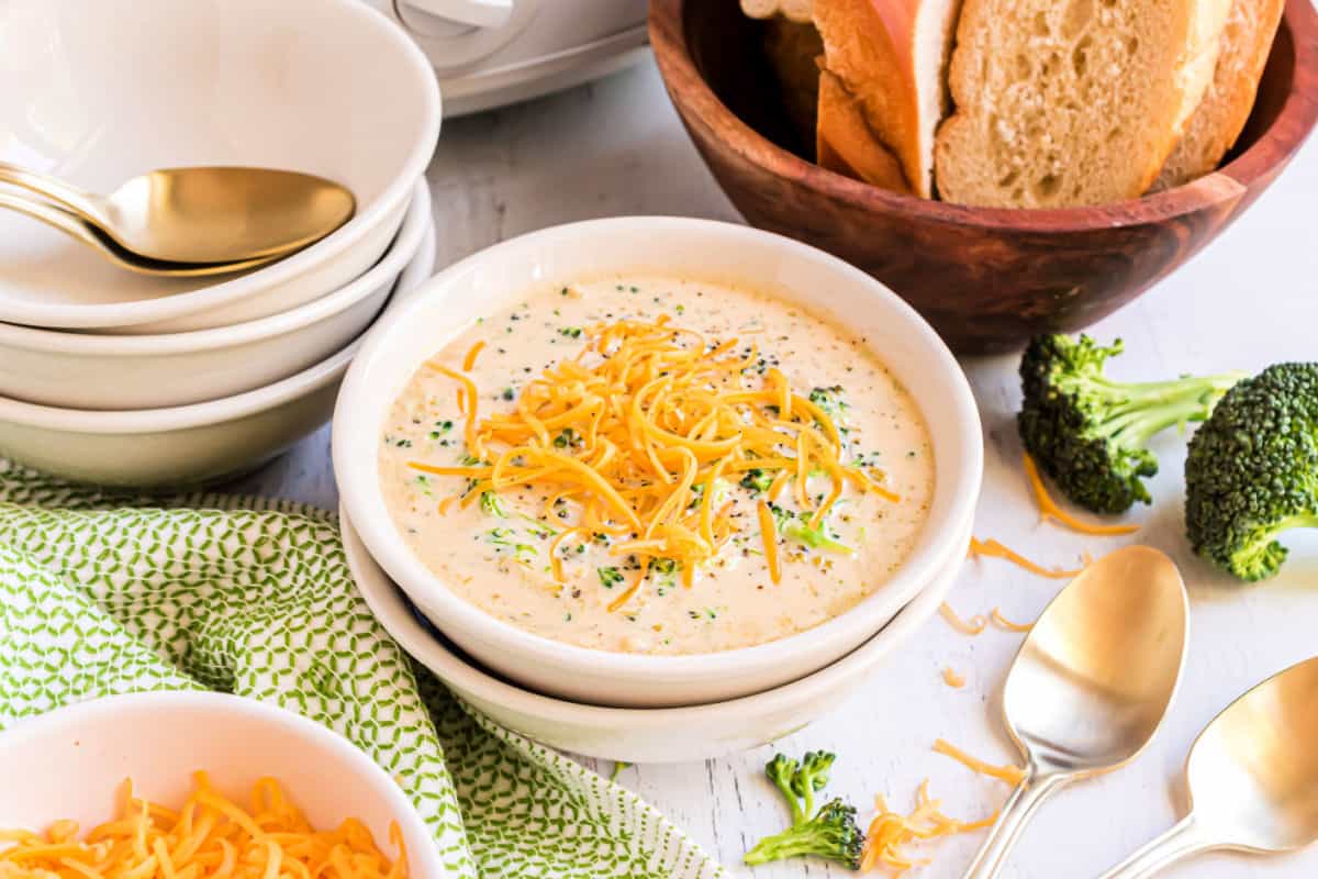 Broccoli cheese soup topped with shredded cheese.