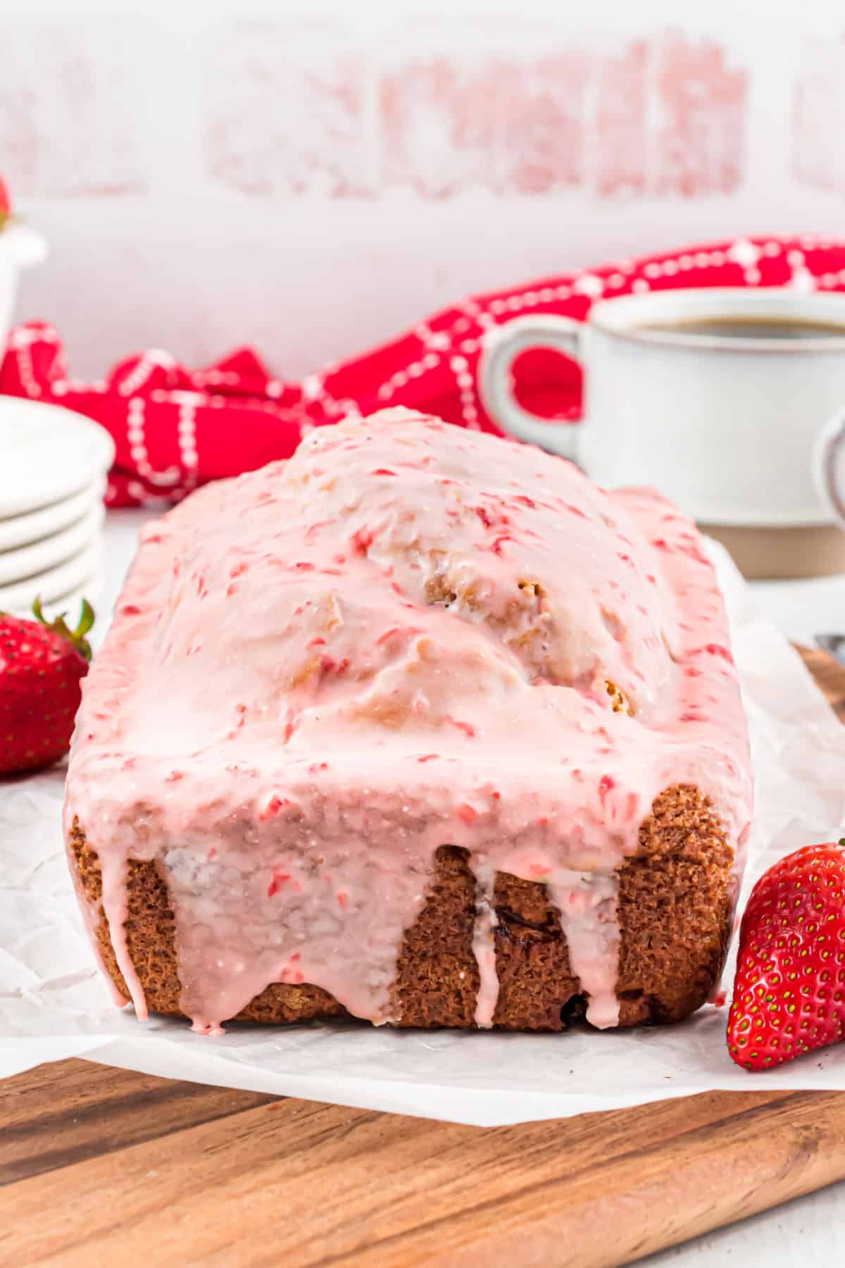 Loaf of bread covered in a strawberry icing.