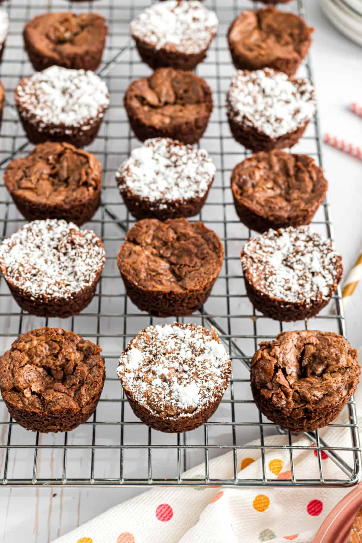 Brownie bites on a wire rack.