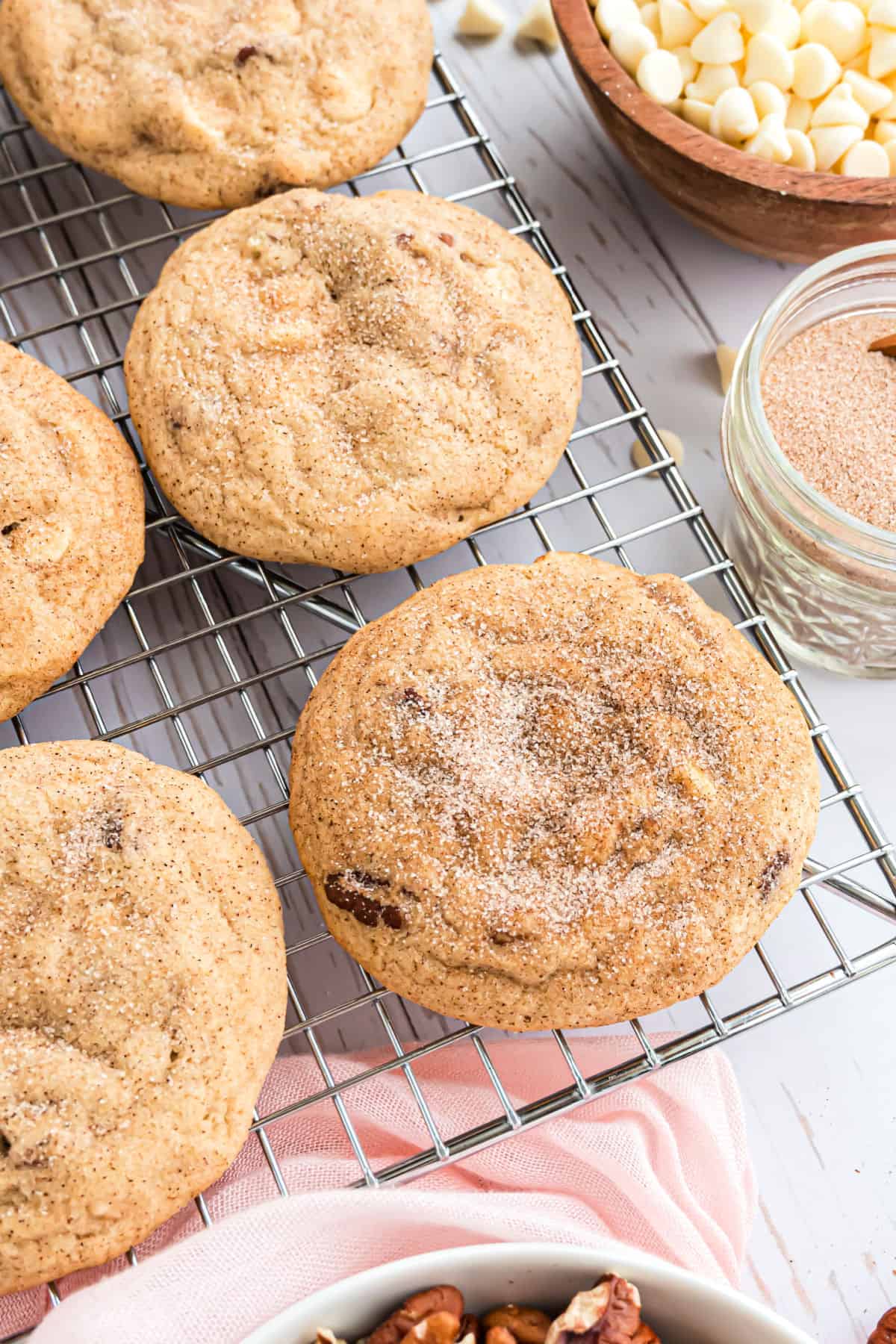 Thick cinnamon cookies on a cooling rack.
