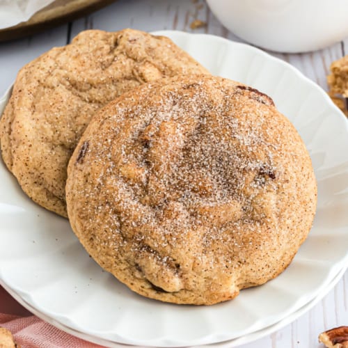 These thick and chewy Cinnamon Cookies are chock full of white chocolate chips and pecans. Much like our snickerdoodles, they're rolled in cinnamon sugar and baked to perfection!