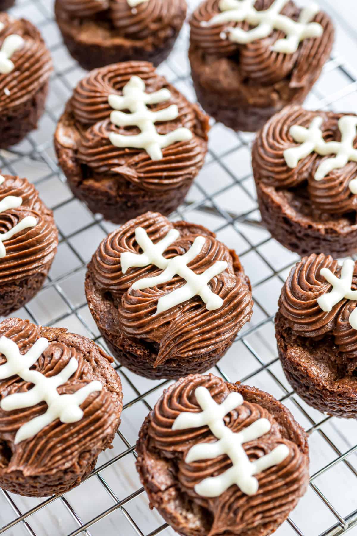 Brownie footballs on a wire rack.