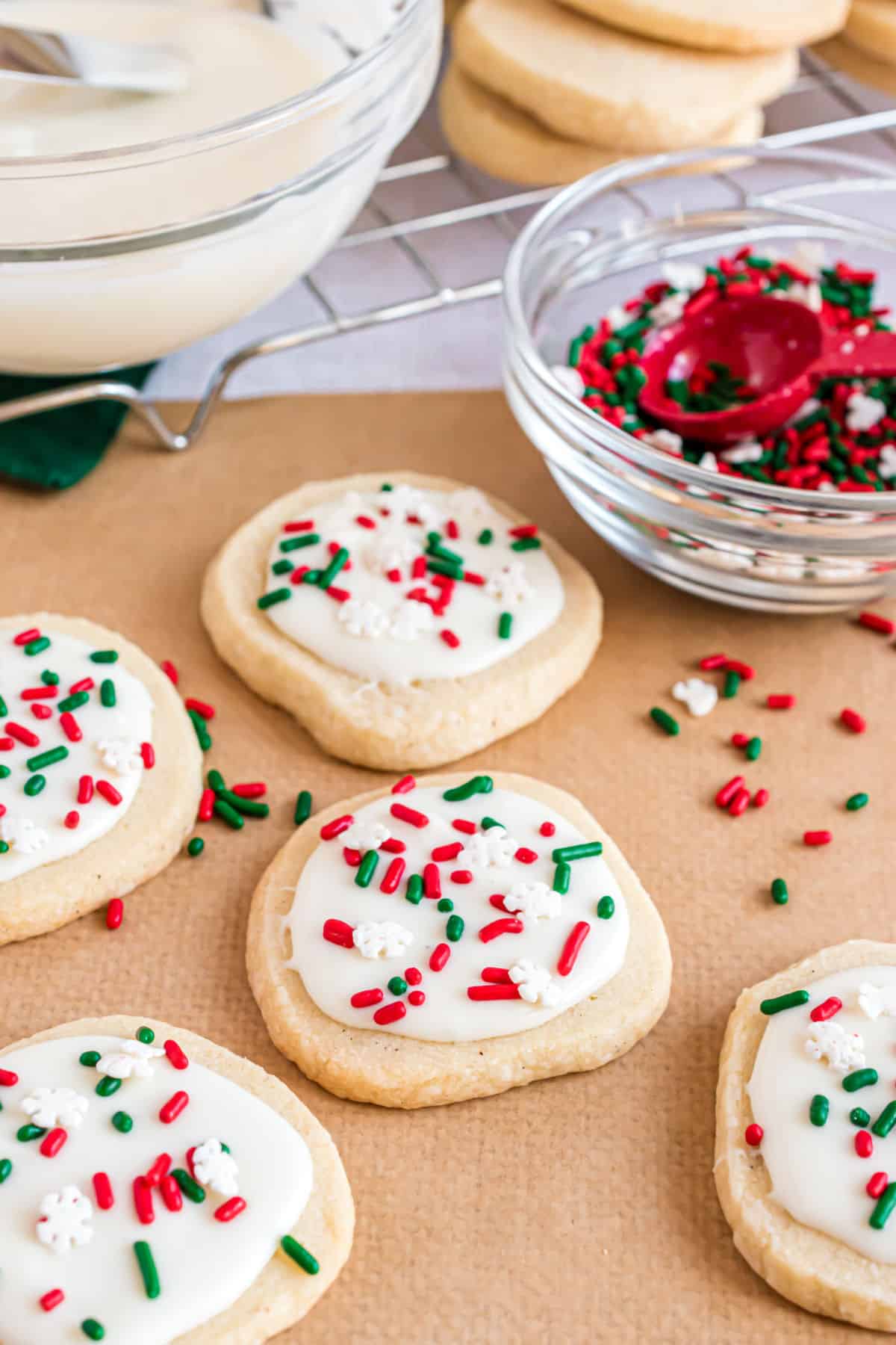 Vanilla shortbread cookies topped with white chocolate and holiday sprinkles.