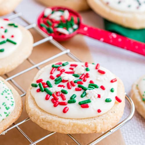 Christmas Shortbread Cookies are the perfect way to deliver holiday cheer. These buttery shortbread cookies are topped with melted white chocolate and holiday sprinkles. They’re easy to make and great for sharing.
