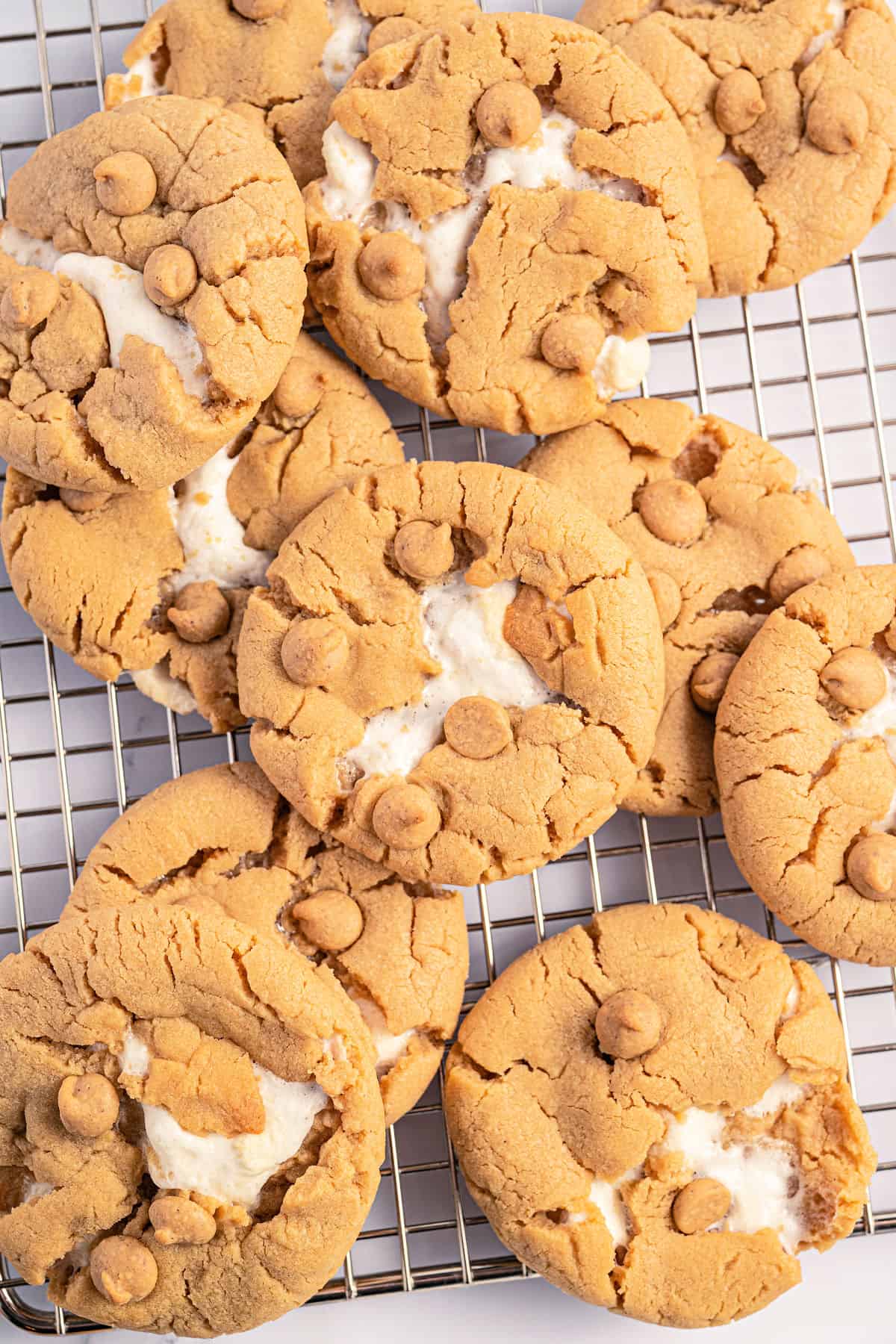 Stacks of fluffernutter cookies on a wire cooling rack.