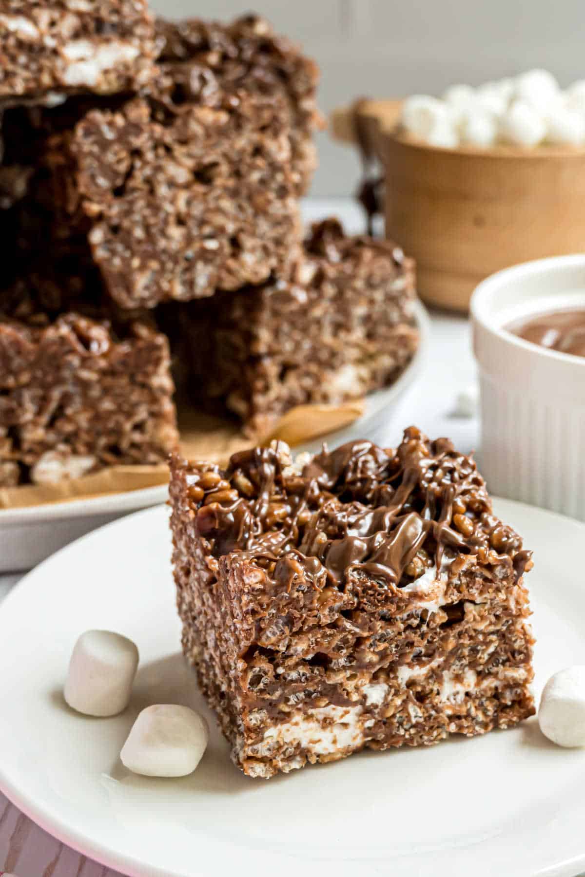 One large nutella krispie treats served on a white plate.