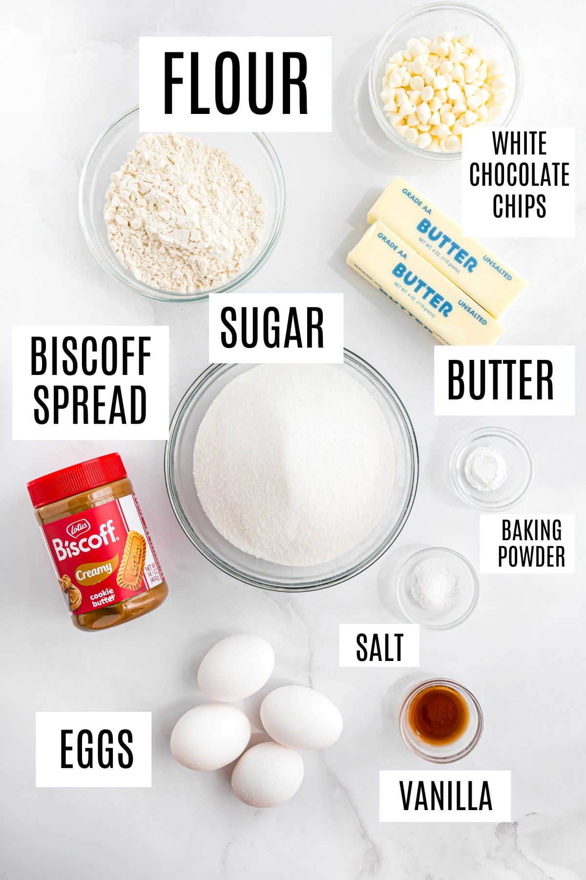 Baking ingredients labeled: flour, sugar, eggs, Biscoff spread, butter, white chocolate chips, baking powder, salt, vanilla.