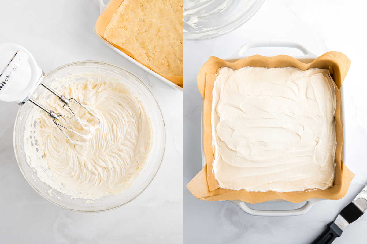 A bowl of whipped frosting with a mixer and a pan of frosted bars lined with parchment paper.