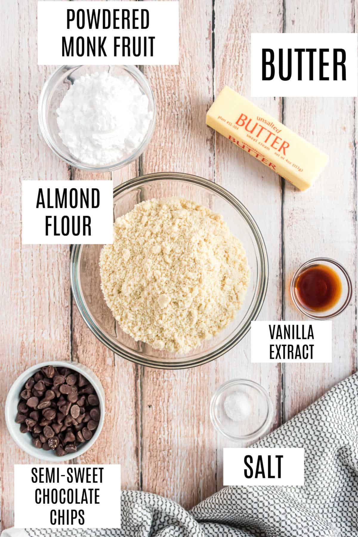Baking ingredients labeled: powdered monk fruit, butter, almond flour, vanilla extract, chocolate chips, and salt.